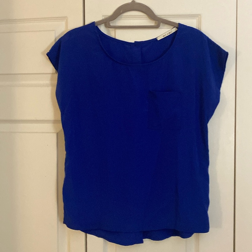 Brand- Miami. Short sleeve size S blue blouse. Pocket on left breast.